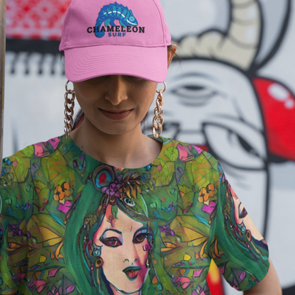 Adelaide Green Goddess Women's T-shirt by Chameleon Surf, crafted in a soft cotton-touch polyester jersey blend, offering vibrant emerald green color and effortless summer style, perfect for beach outings, yoga, and casual wear. Chameleon Surf Pink Hat also shown.