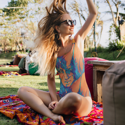 Aiden Orange Blue Goddess One-Piece Swimsuit by Chameleon Surf, featuring a bohemian design with a cheeky fit, scoop neckline, and durable chlorine-resistant fabric, perfect for poolside and beach adventures.